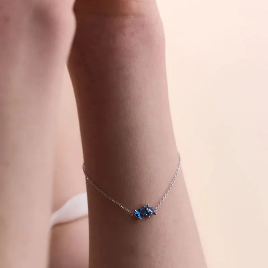 Sterling Silver Bracelet with Blue Topaz Stones – Elegant and Delicate