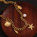 Trendy Gold Charm Bracelet with Seashell and Starfish Pendants – Link Chain for Women - Begum