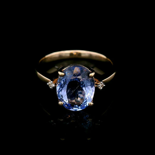 Natural Oval Tanzanite with Diamond Dress Ring in Yellow Gold